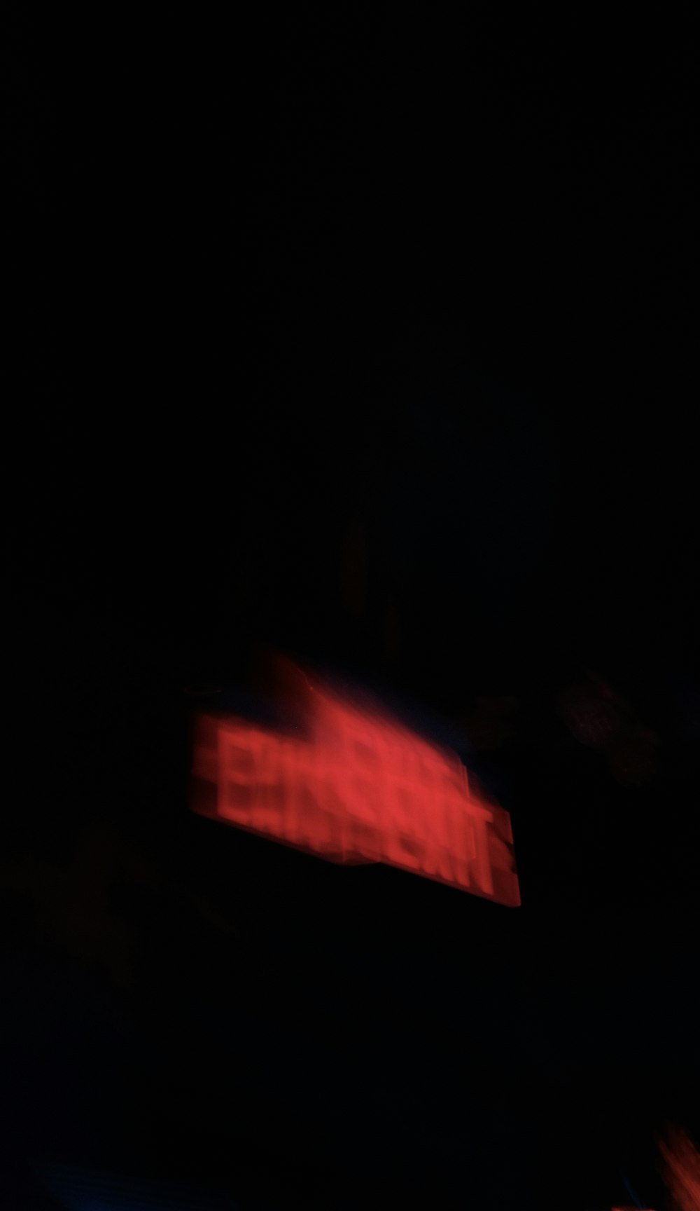 a blurry photo of a building in the dark