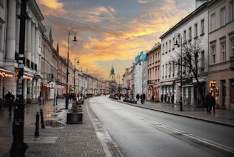 a city street with people walking on the sidewalks