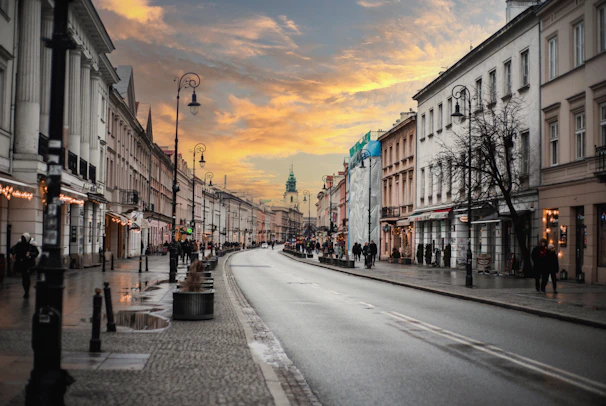 a city street with people walking on the sidewalks