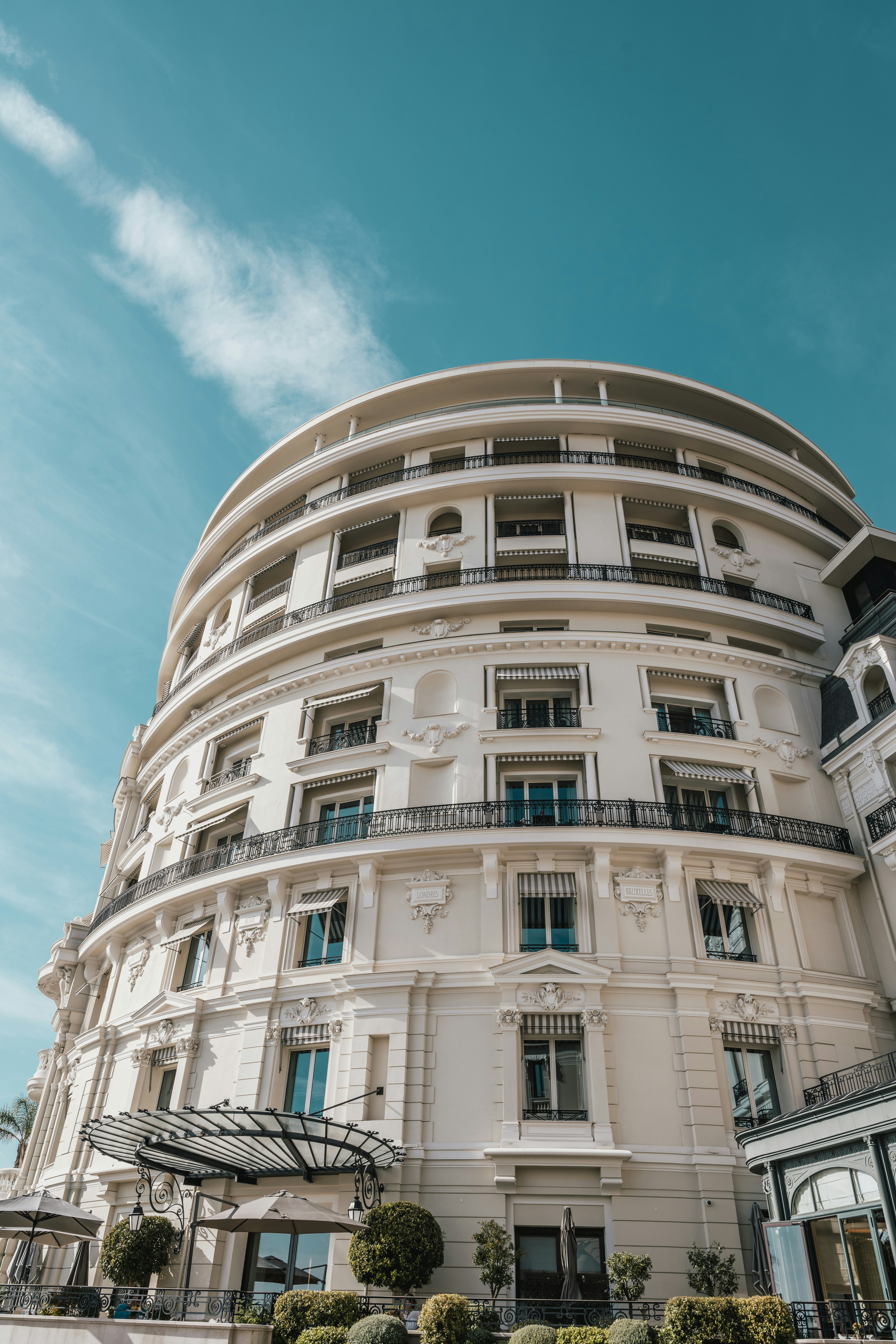 a large white building with balconies on the top of it