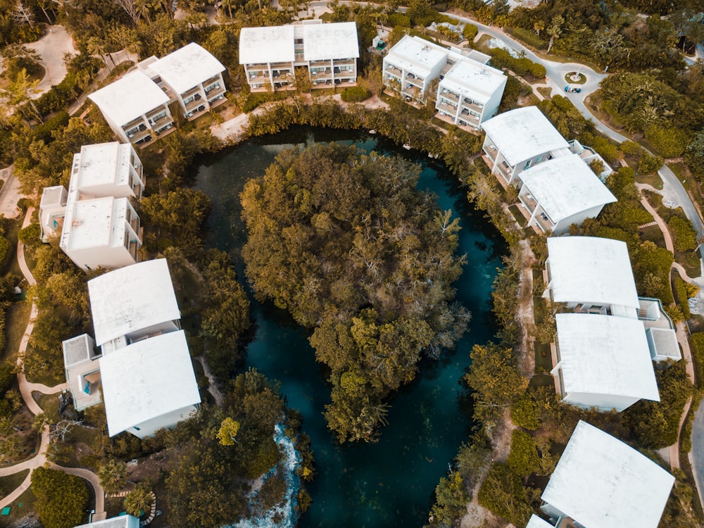 an aerial view of a resort surrounded by trees