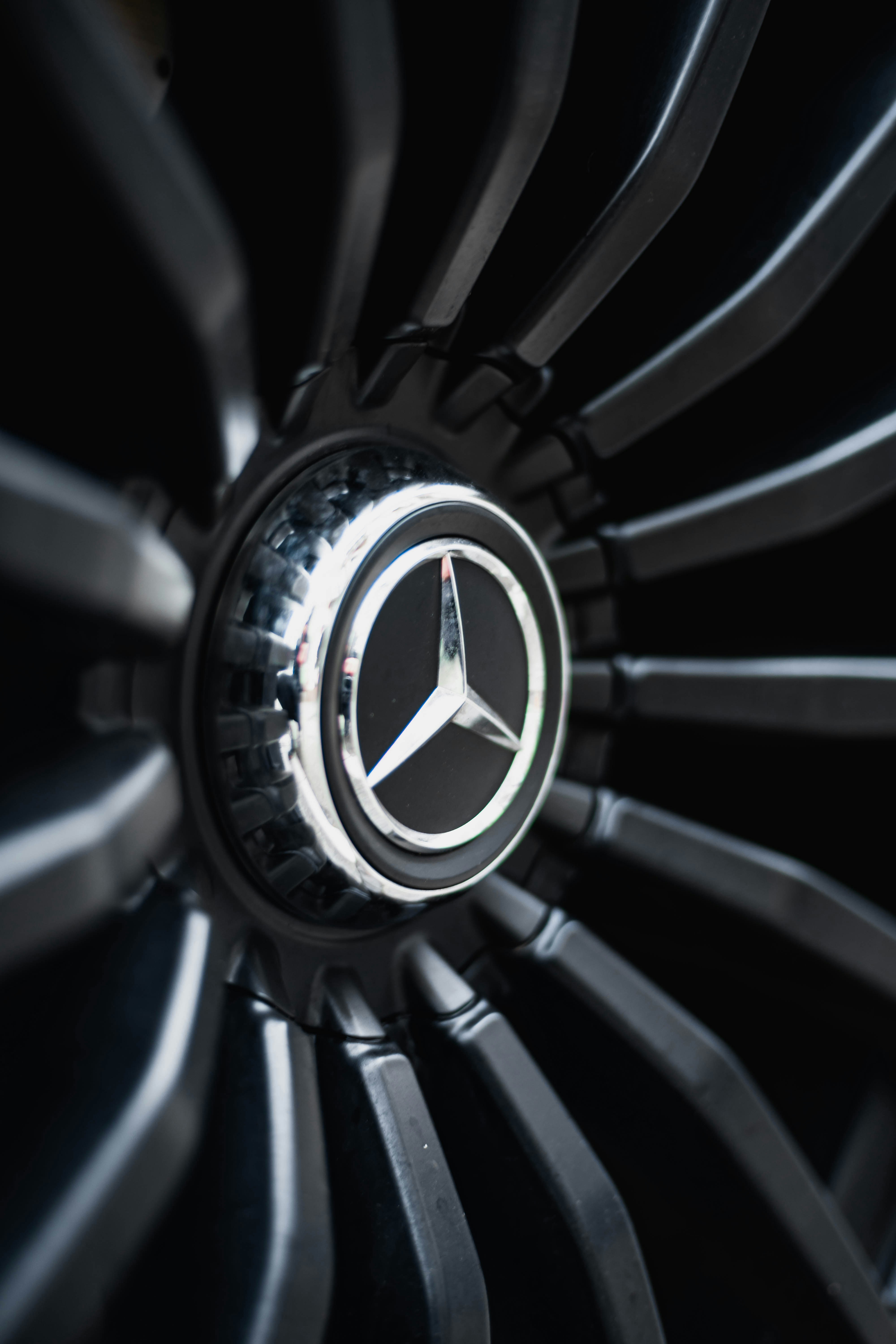 a close up of a mercedes logo on a jet engine