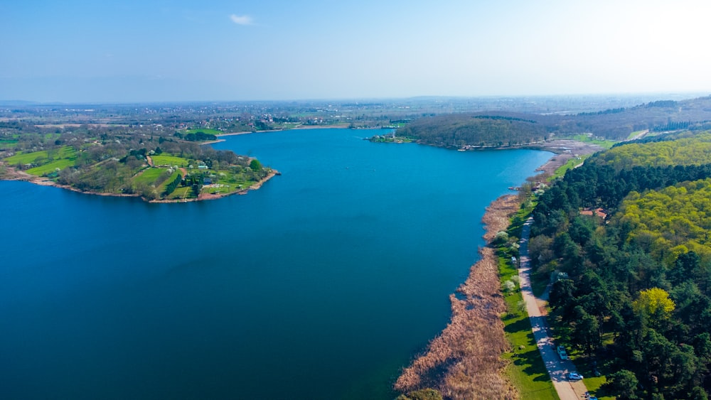 a large body of water surrounded by trees