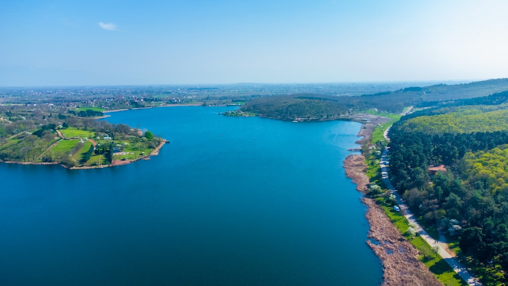 a large body of water surrounded by trees