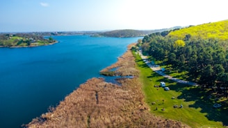 a large body of water surrounded by trees