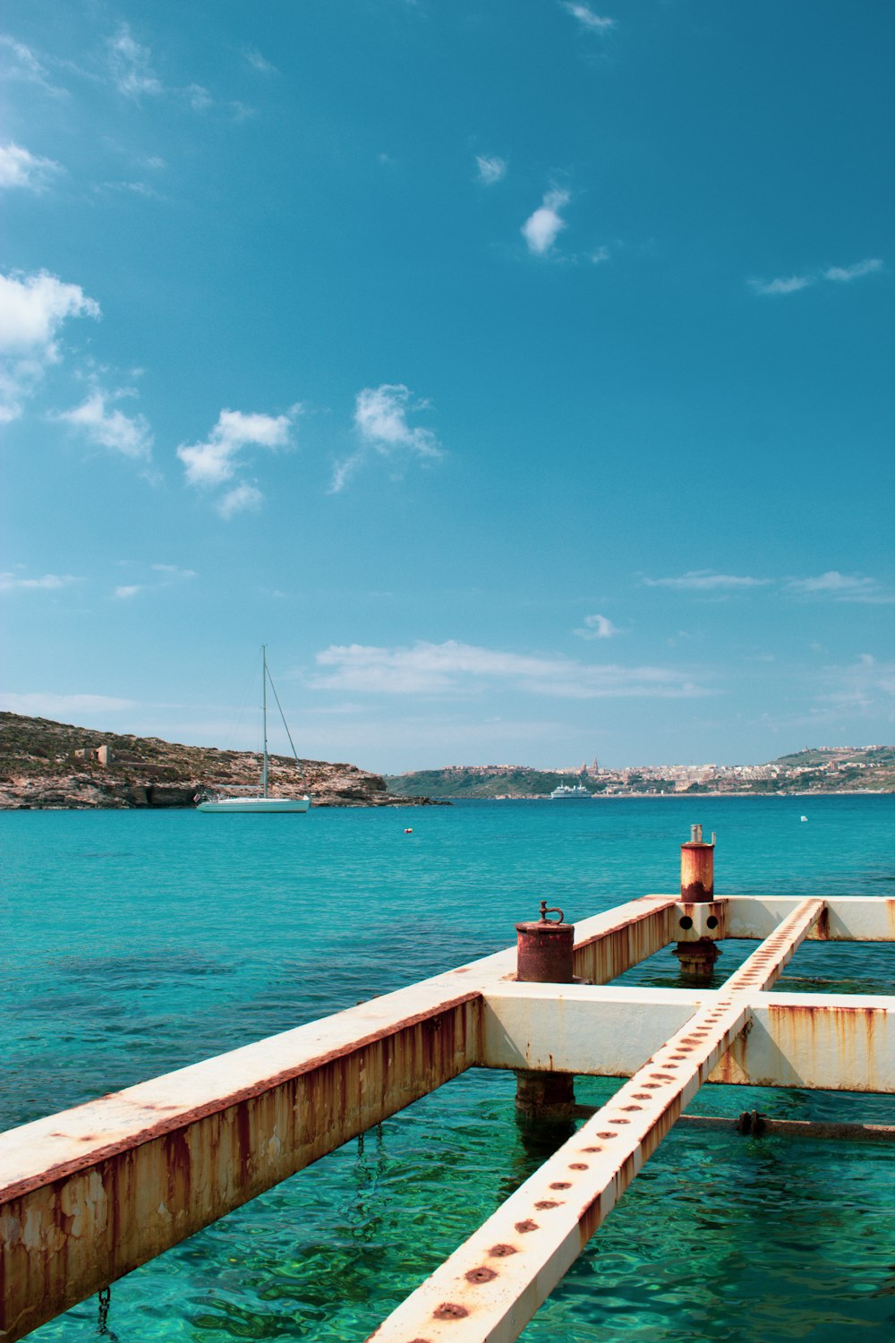 a boat dock in the middle of a body of water