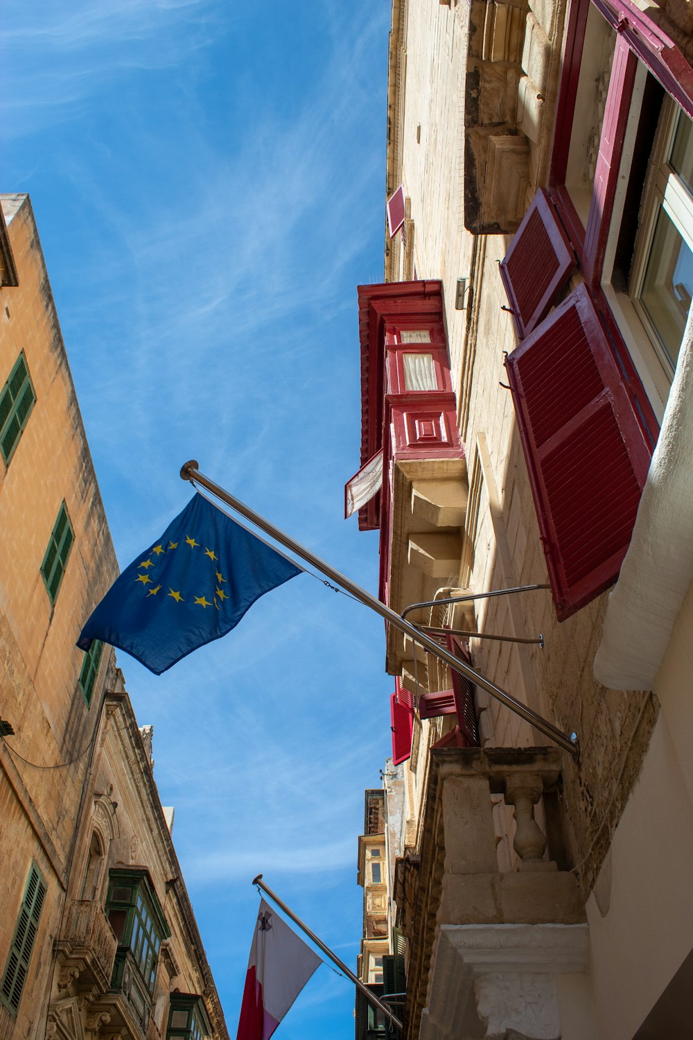 a european flag flying in front of a building