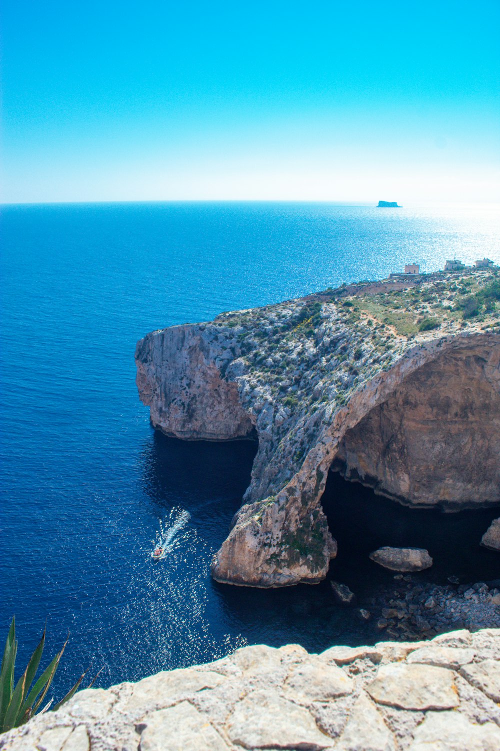 a view of the ocean from the top of a cliff