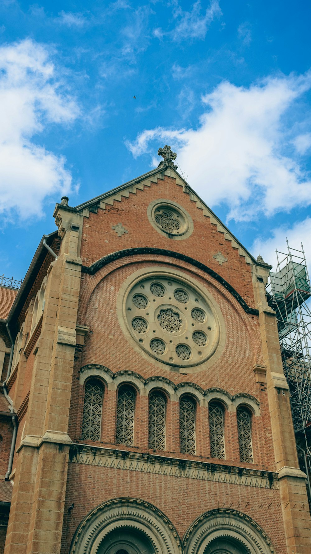 a tall church with a clock on the front of it