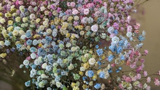 Delicate pastel-colored flowers arranged in a round bouquet for a spring celebration.