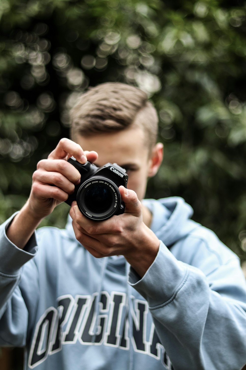 a man taking a picture with a camera