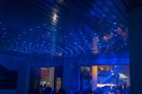 A family having fun together in a laser space, surrounded by futuristic decor.