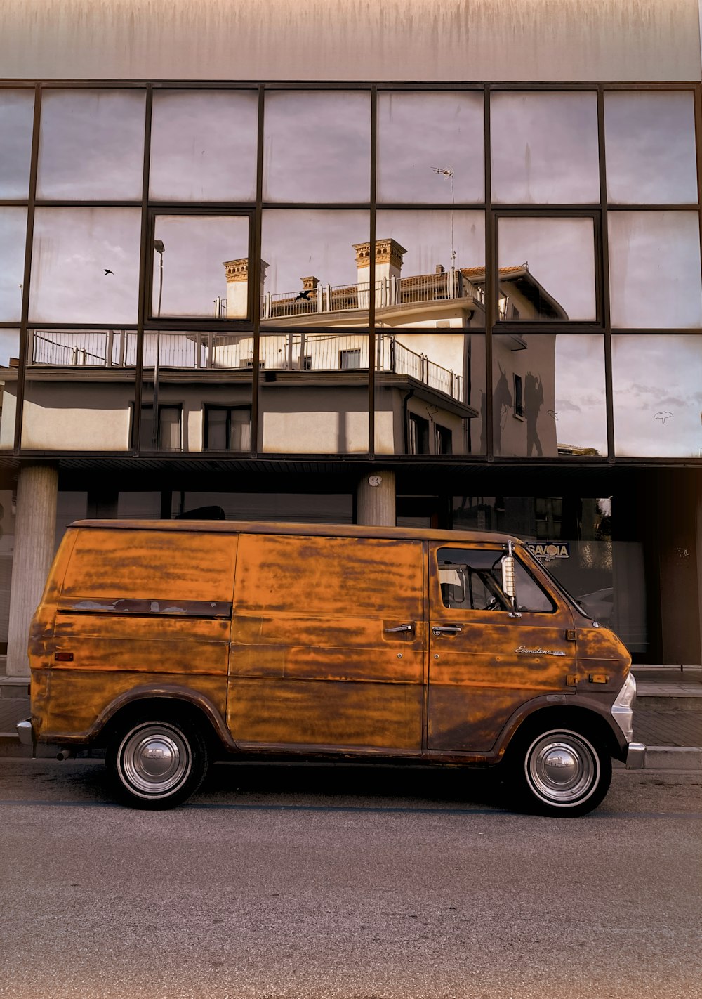 a van is parked in front of a building