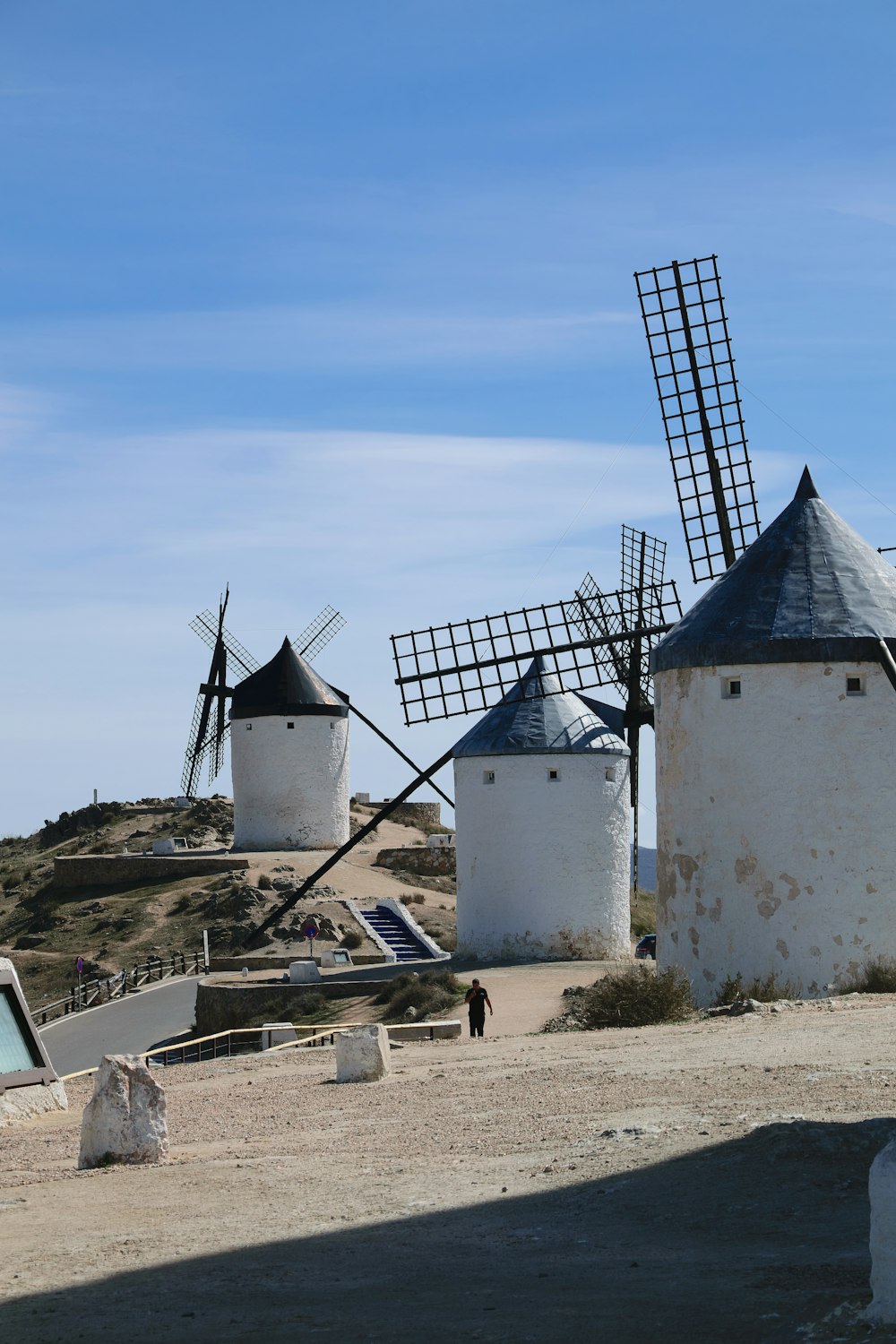 a group of windmills sitting on top of a hill