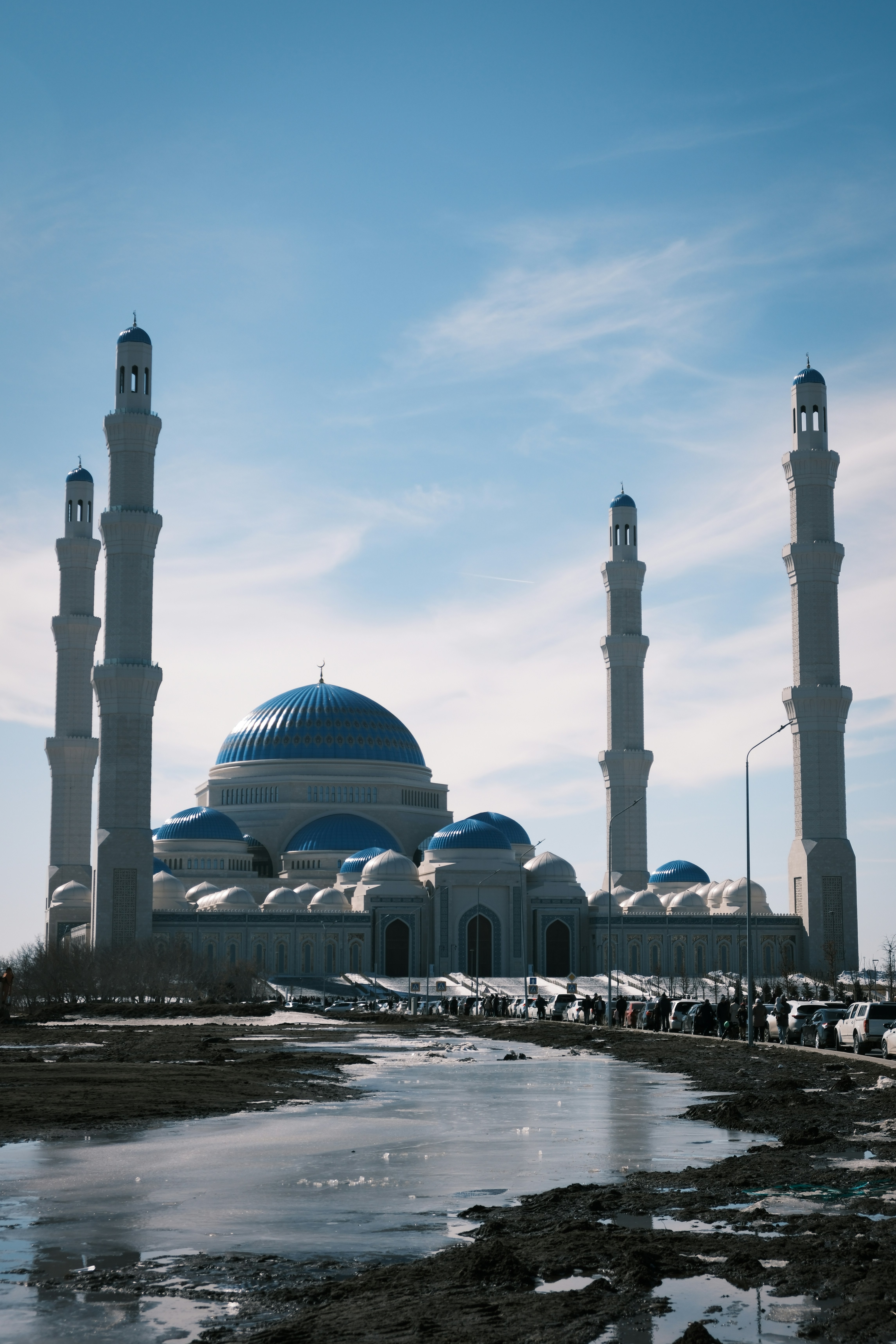 a group of people standing in front of a large building