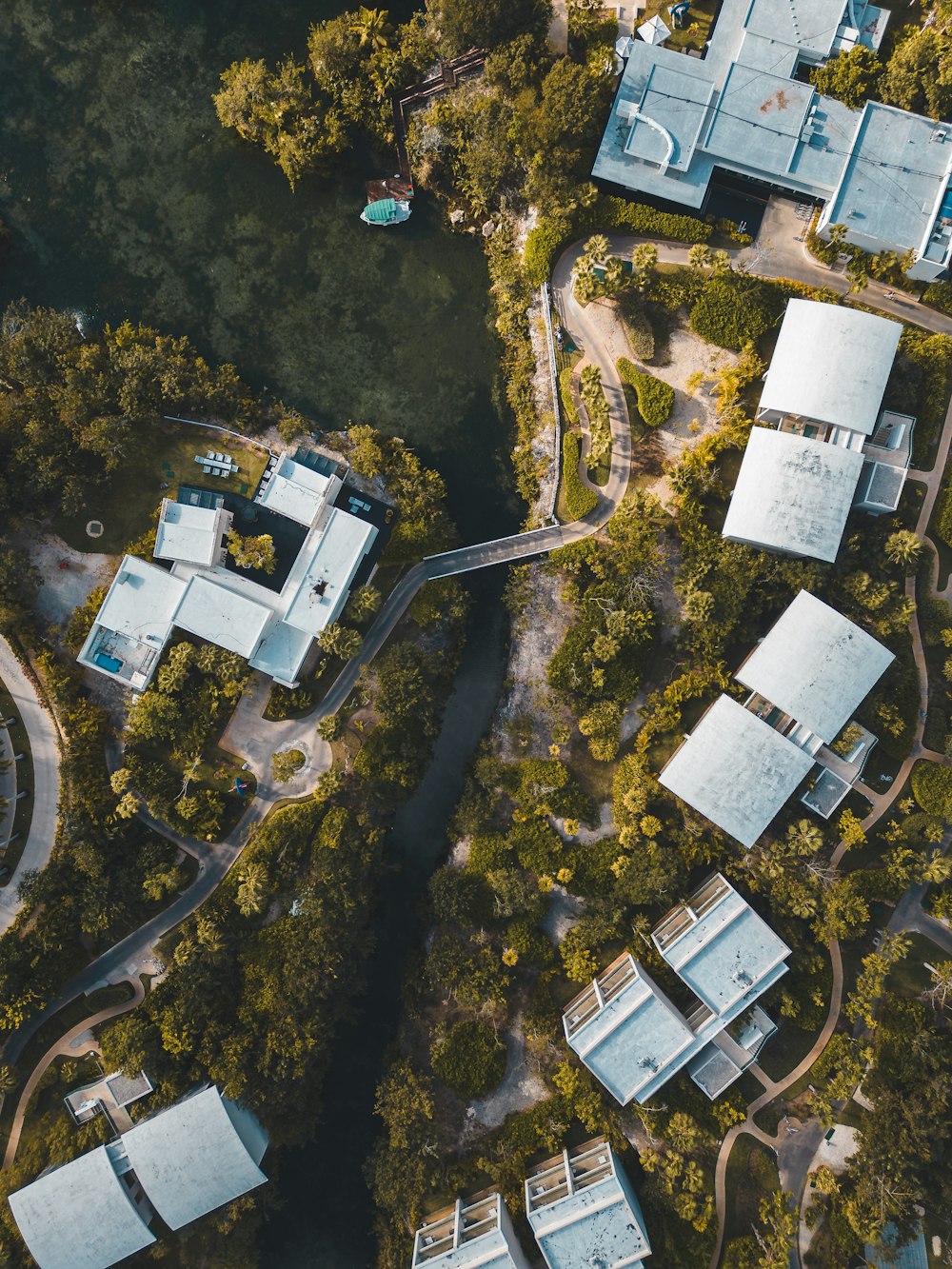 an aerial view of a building surrounded by trees