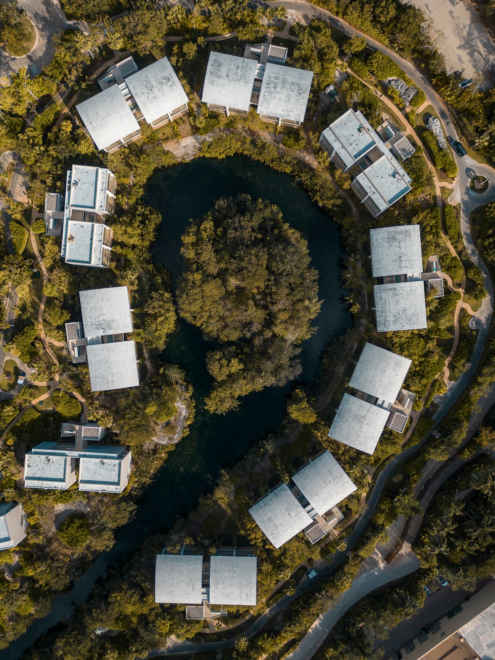 an aerial view of a building surrounded by trees