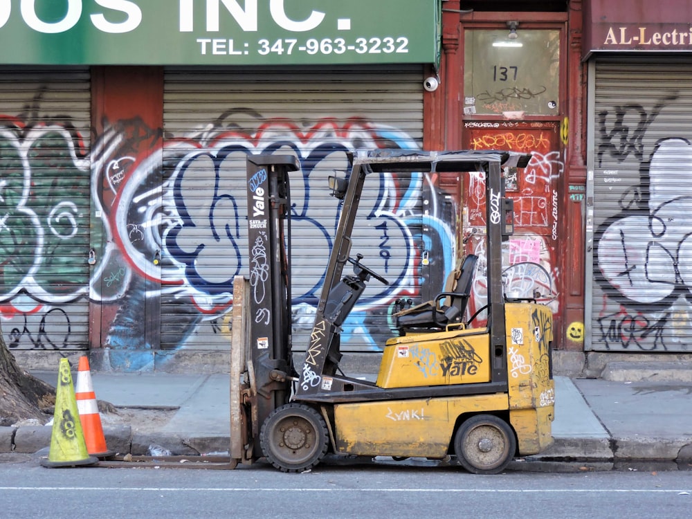 a forklift parked on the side of a street