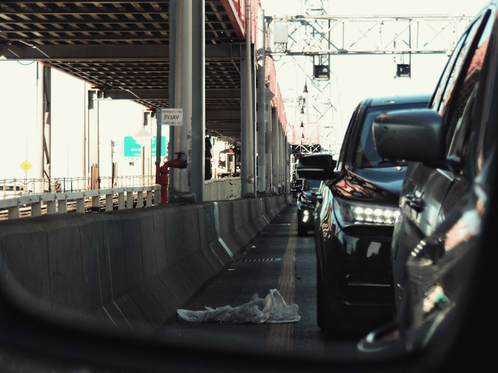 a rear view mirror on a car driving down a street