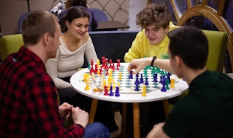 a group of people playing a game of chess