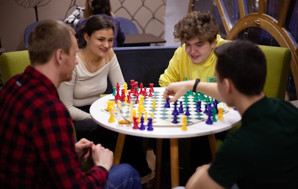 a group of people playing a game of chess