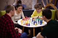 A diverse group of players of all ages gathered around tables, enjoying a friendly chess competition.