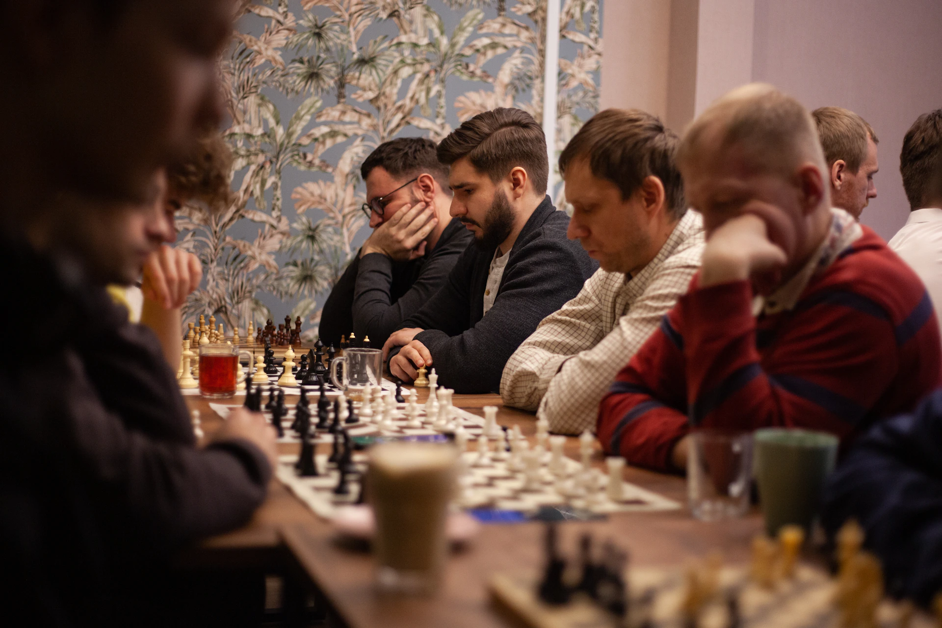 A vibrant photo of young chess players deeply focused during a lively classroom session at Mindspark Academy.