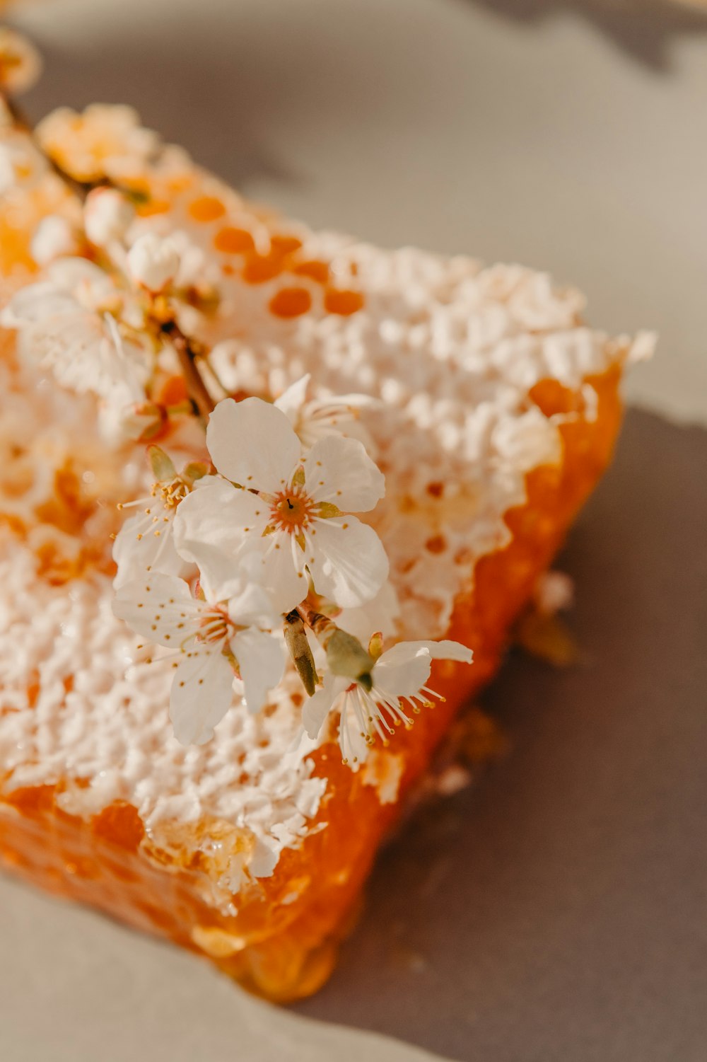 a piece of cake with white flowers on it