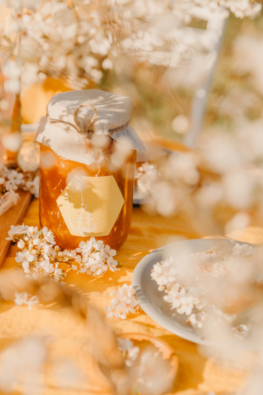 a jar of honey sitting on a table