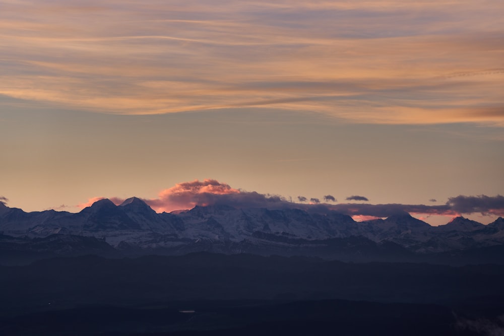 a view of a mountain range at sunset