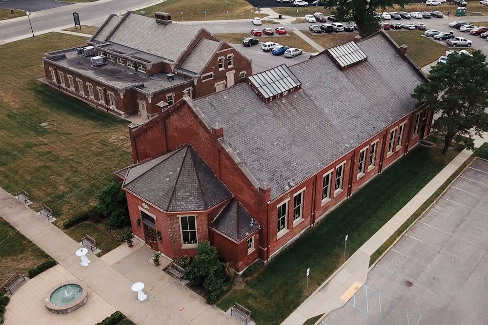 an aerial view of a building with a solar panel on the roof