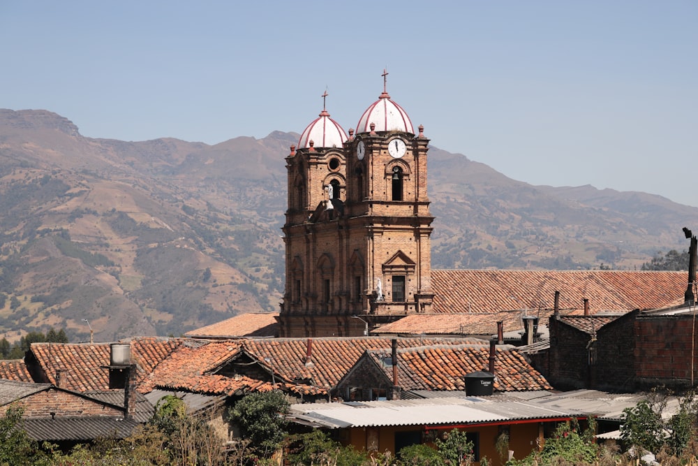 an old church with a steeple in the background