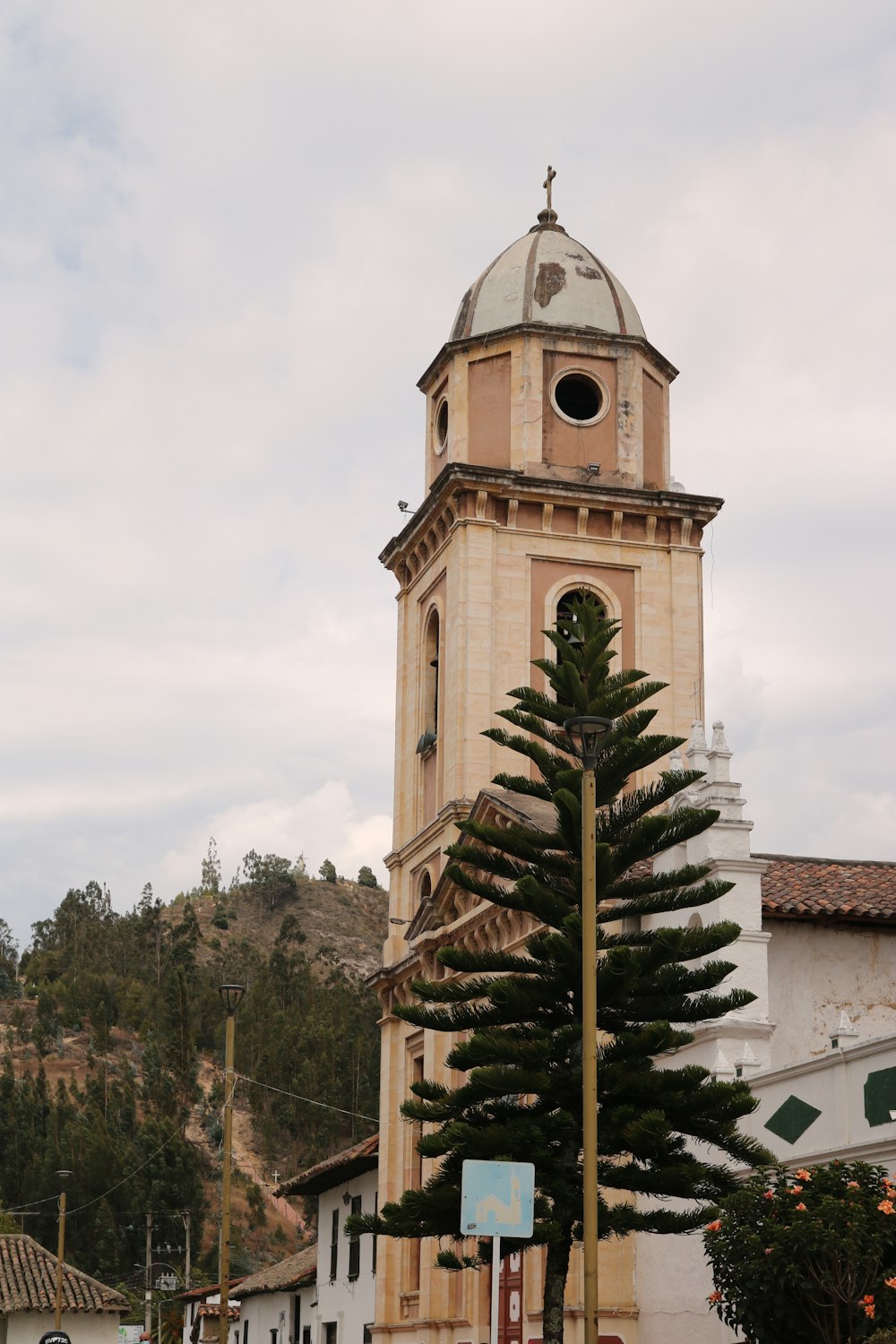 a tall tower with a clock on the top of it