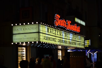 a theater marquee lit up at night