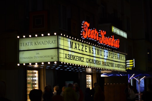 a theater marquee lit up at night