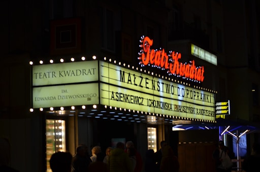 a theater marquee lit up at night