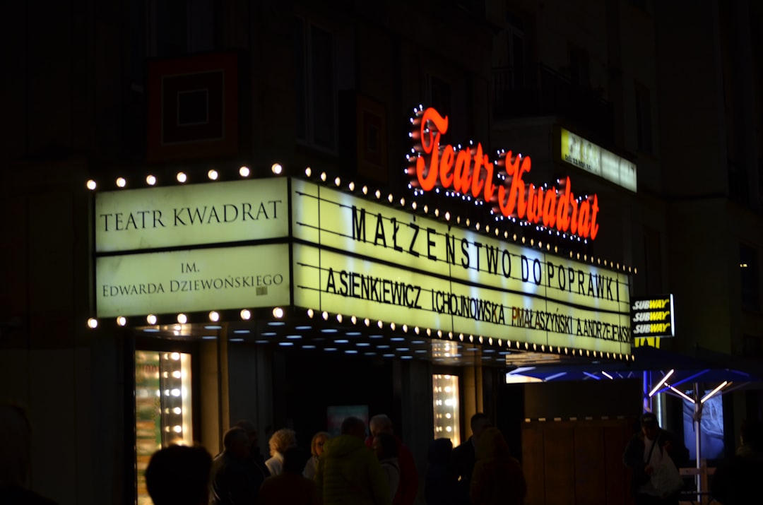 a theater marquee lit up at night