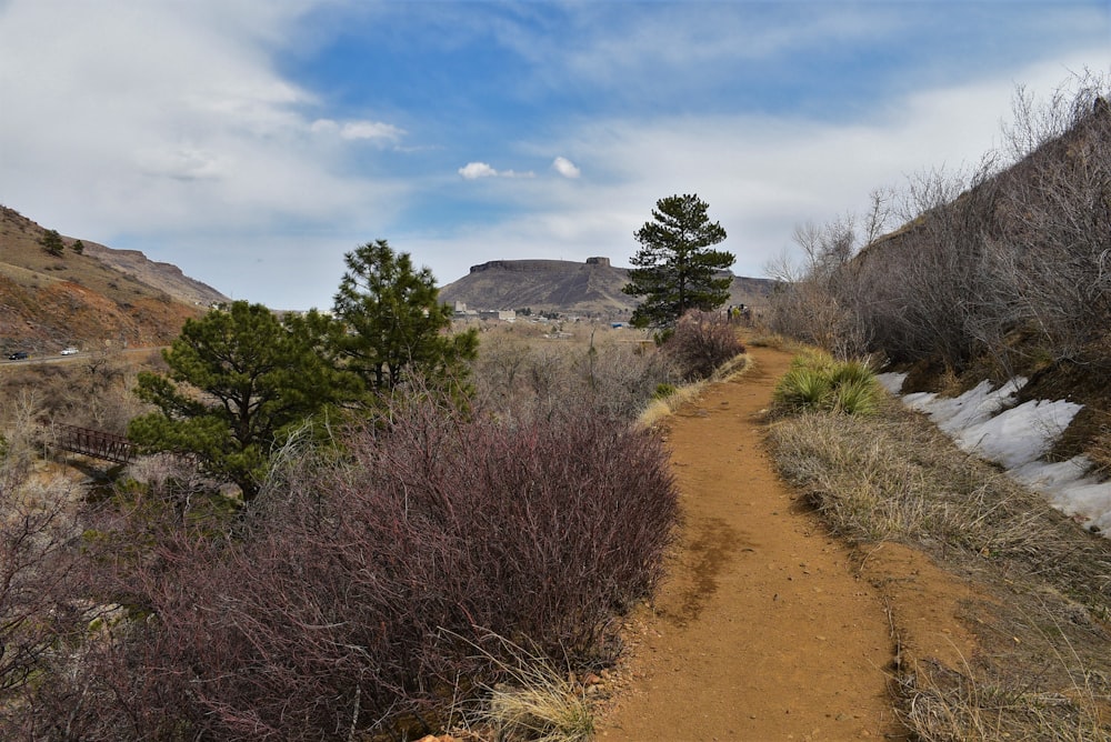 a dirt path in the middle of a mountain