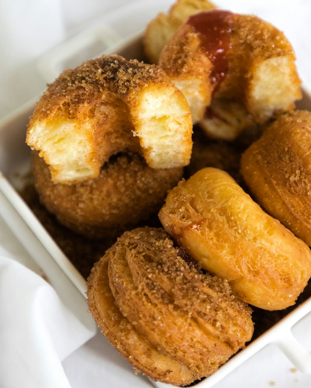 a close up of a box of doughnuts