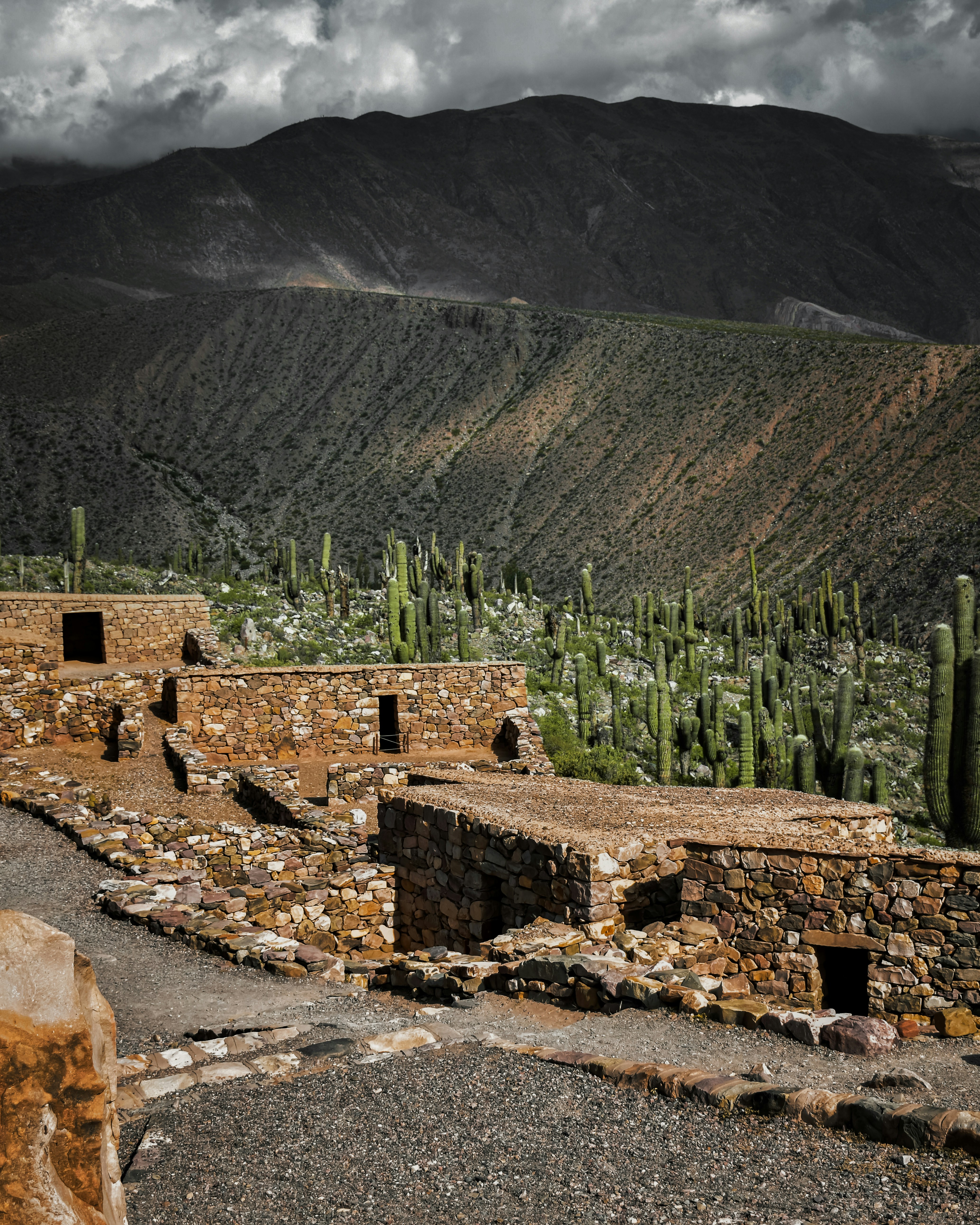 a stone building in the middle of a desert
