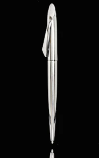 Shiny metallic pens and badges engraved with precise laser printing, reflecting light beautifully.
