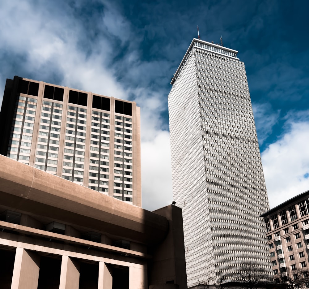 a very tall building next to a very tall building