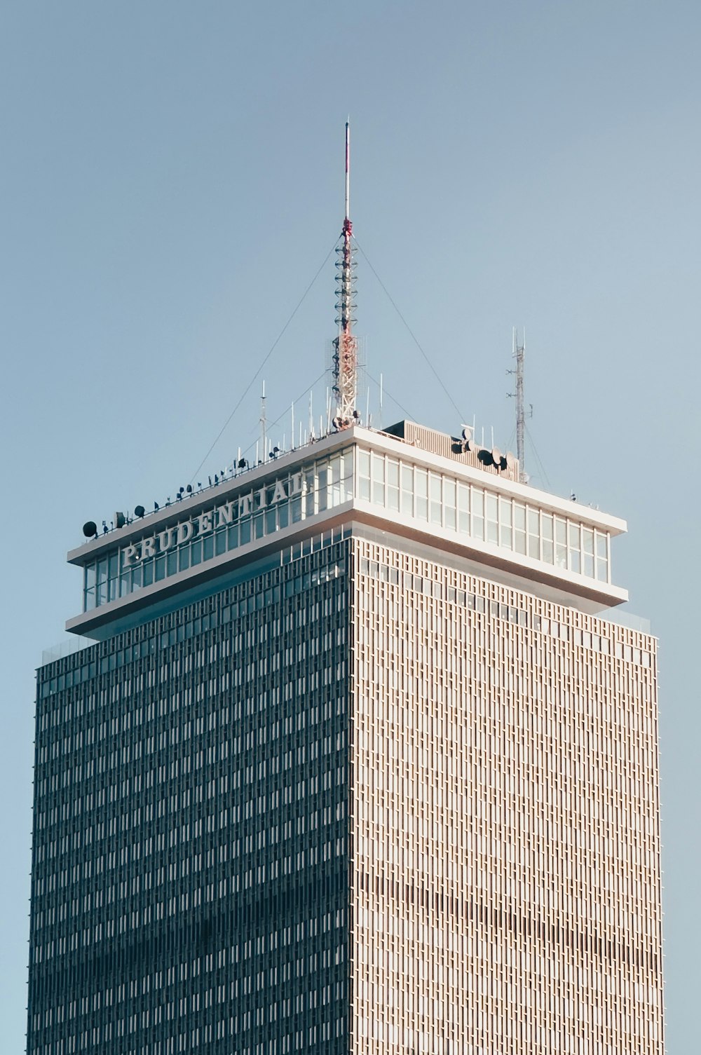 a tall building with a radio tower on top of it