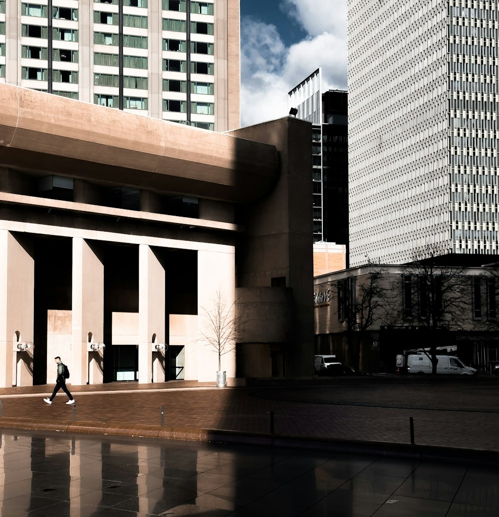 a couple of people that are standing in front of a building