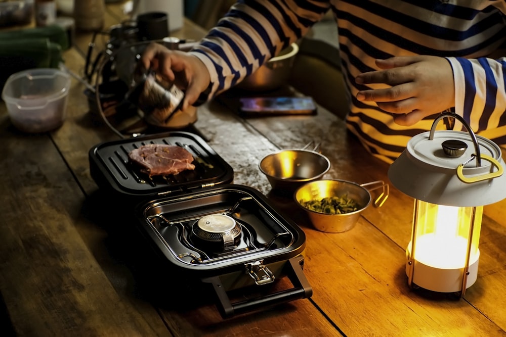 a person is cooking food on a table