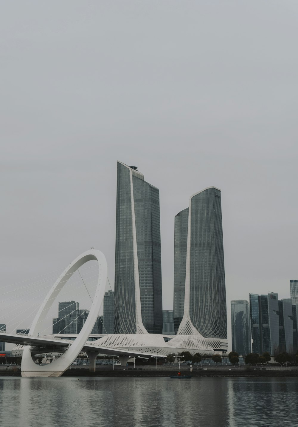 a large body of water next to tall buildings