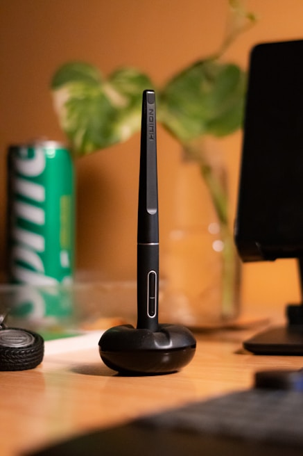 Saycolor pen elegantly placed on a marble desk with a voice command icon subtly glowing nearby