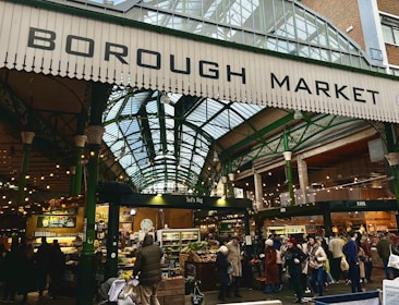 a group of people standing around a market