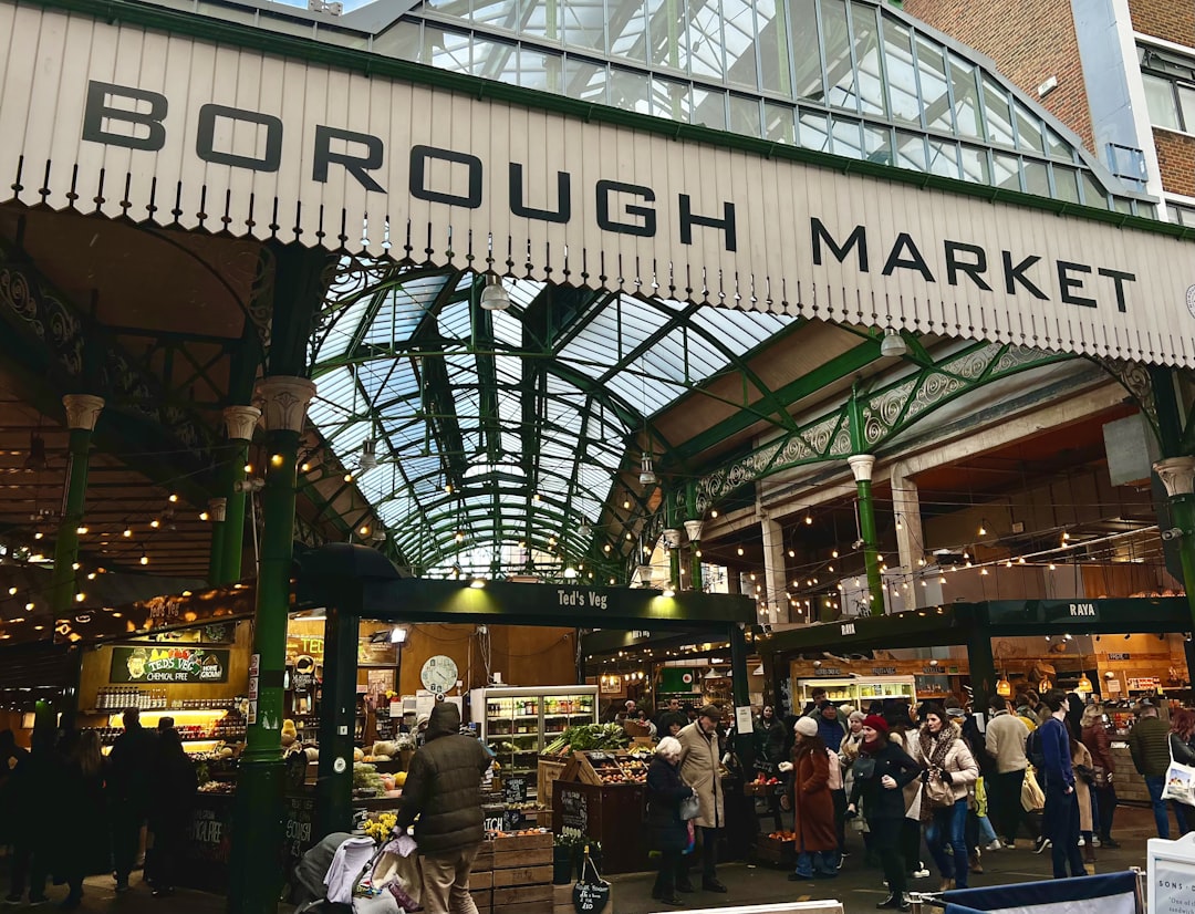 a group of people standing around a market, Borough Market