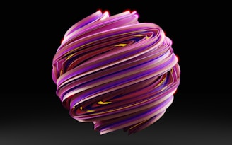 a purple and yellow object with a black background